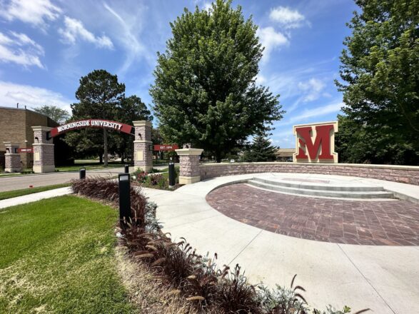 Reynders Plaza welcomes visitors to the Morningside University campus with its arch stretching over Peters Avenue, monument signs, and M sculpture. 