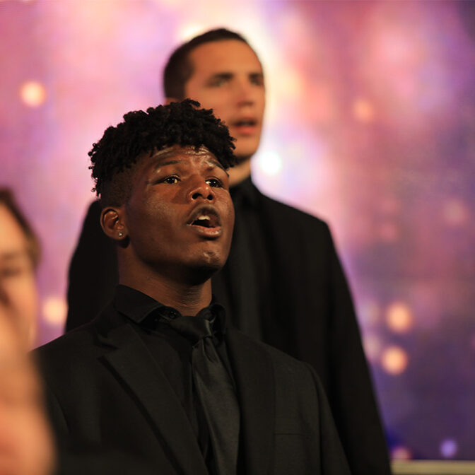 Male Student Singing At Christmas At Morningside