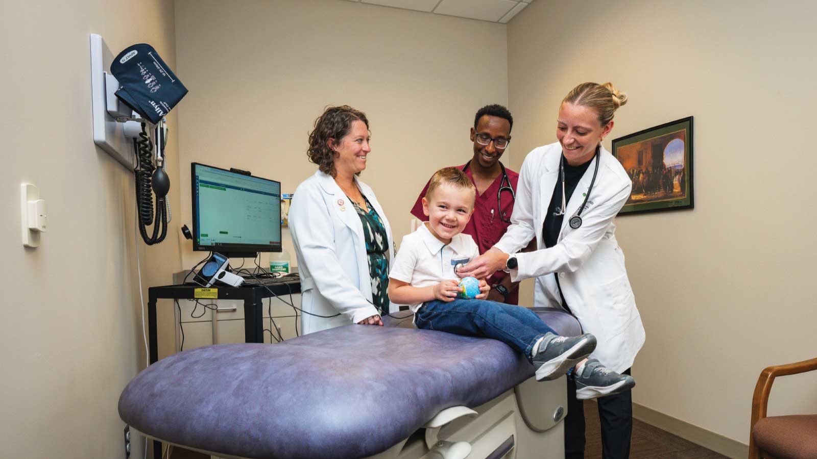 nurse and doctors with a patient