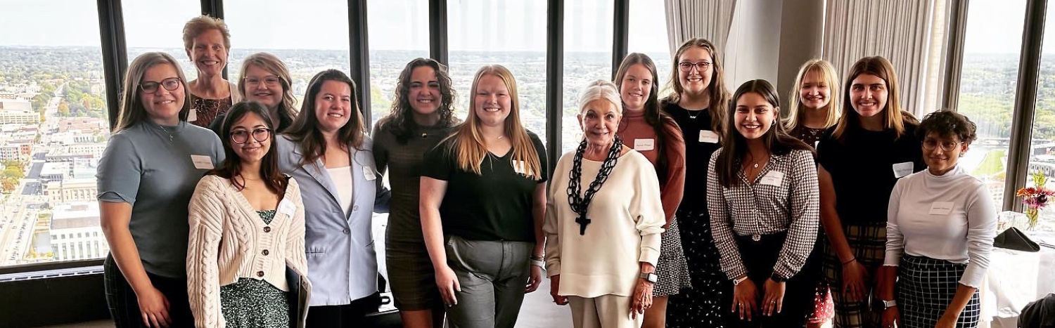 Connie Wimer with a small group of young women in the Connie Wimer Women's Leadership group