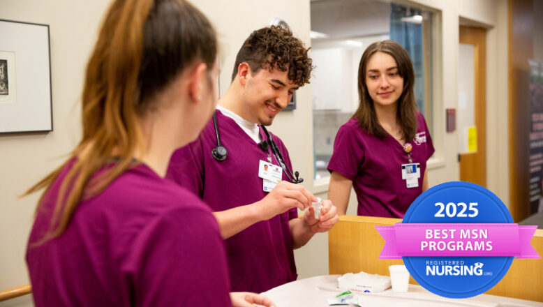 three nursing students working together at a counter.