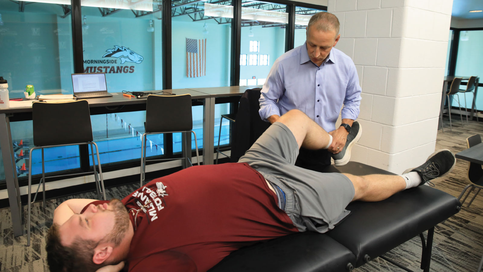 Student working with a trainer