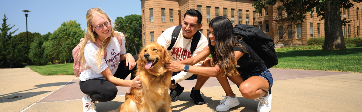 students with dog ambassador