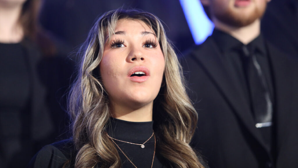 woman singing in the choir